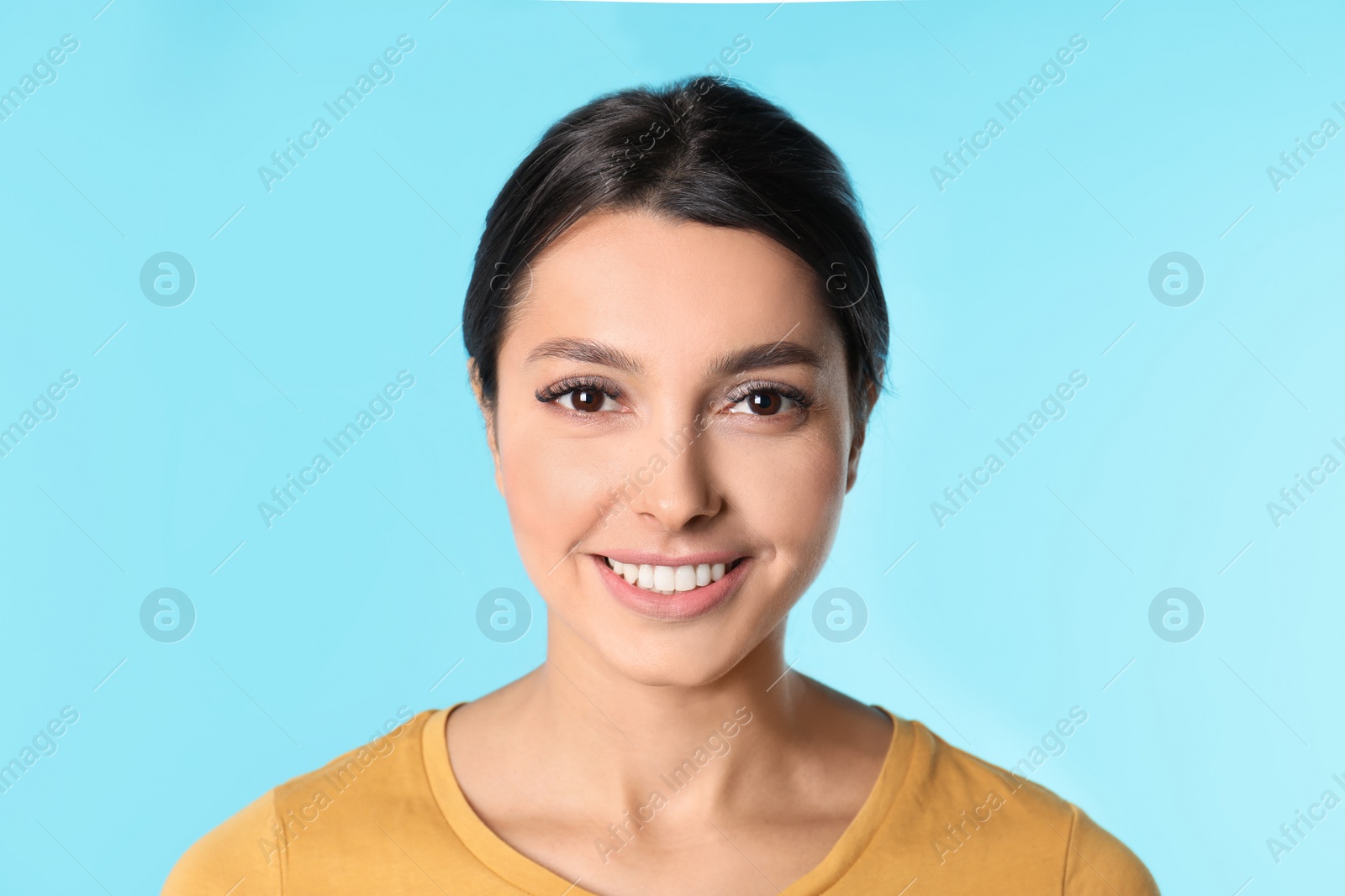 Photo of Young woman with healthy teeth on color background