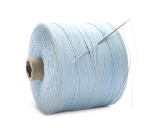 Light blue sewing thread with needle on white background