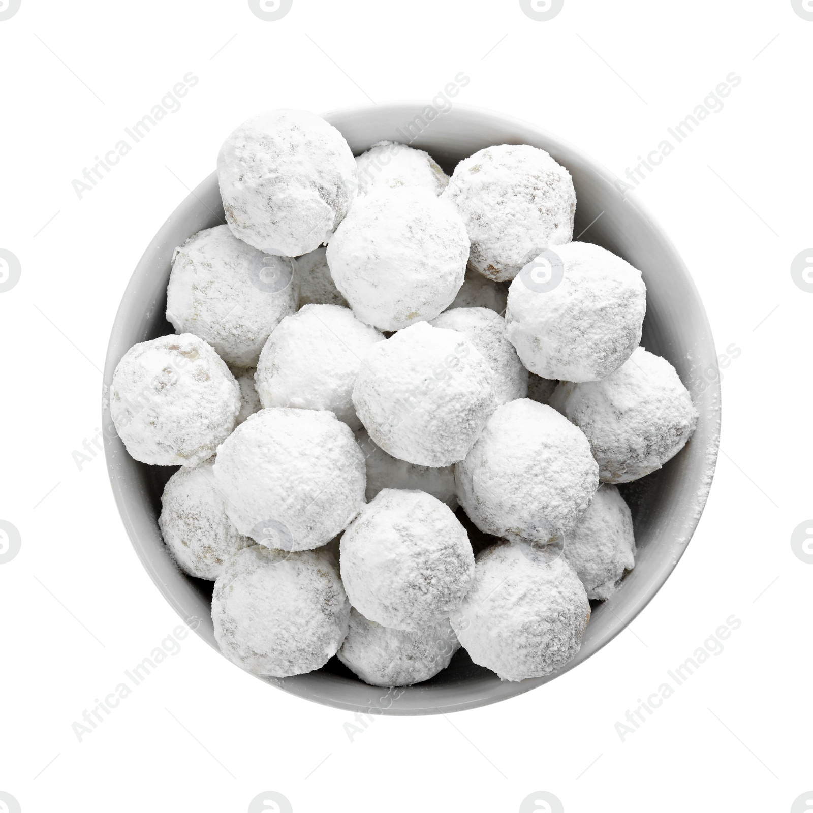 Photo of Tasty Christmas snowball cookies in bowl isolated on white, top view