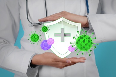 Immunologist and shield with cross as symbol of virus protection, closeup