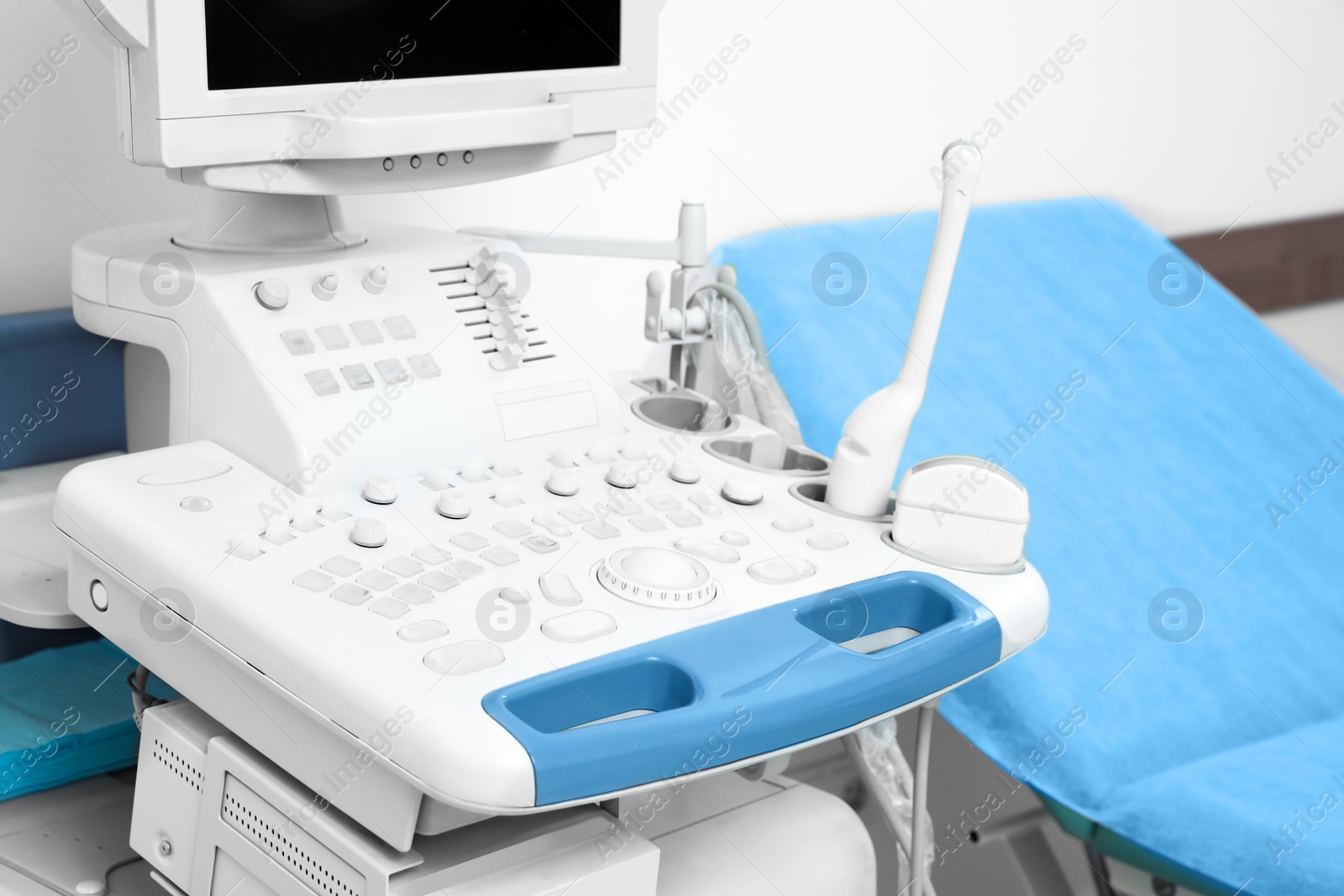 Photo of Ultrasound machine and examination table in hospital, closeup