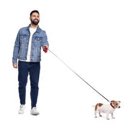 Smiling man walking with dog on white background