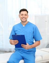 Professional physiotherapist waiting for patients in rehabilitation clinic