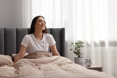 Beautiful woman in bed at home. Lazy morning