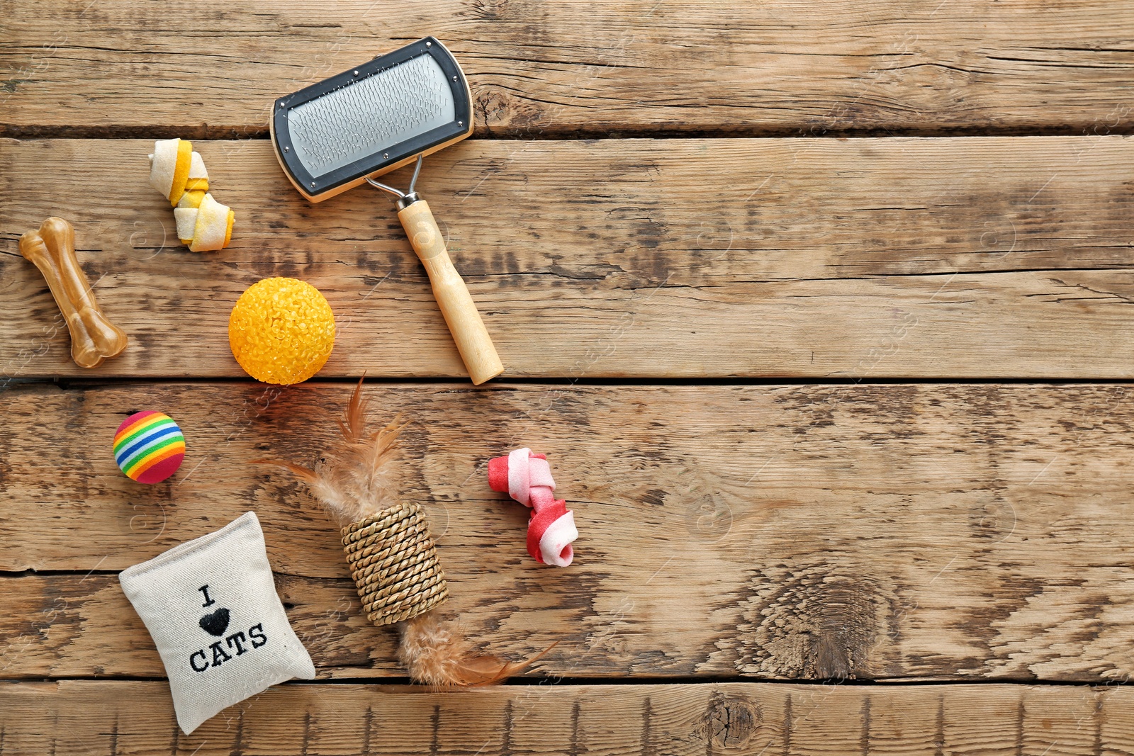 Photo of Cat's accessories on wooden background