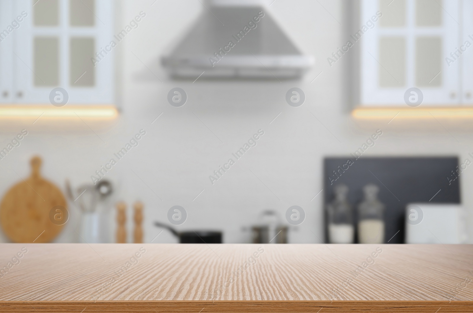 Image of Wooden table in light kitchen. Space for design