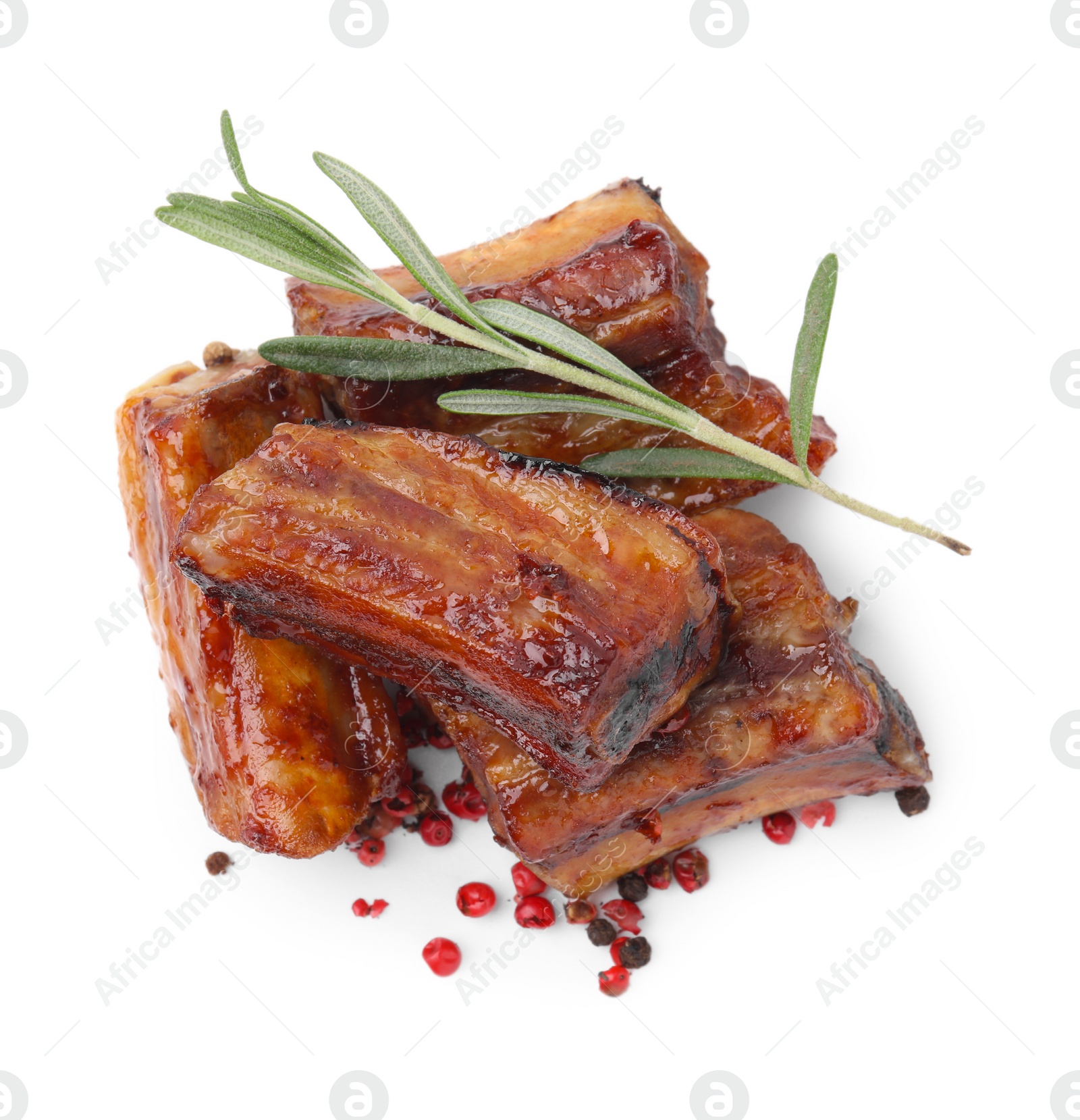 Photo of Tasty roasted pork ribs, rosemary and peppercorns isolated on white, top view