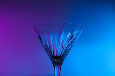 Photo of Empty clean martini glass in neon lights