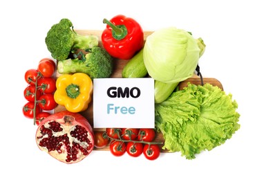 Photo of Tasty fresh GMO free products and paper card on white background, top view