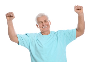 Portrait of mature man laughing on white background