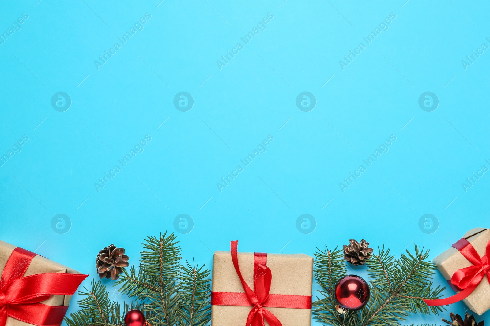 Photo of Flat lay composition with Christmas gifts on light blue background, space for text. Boxing day