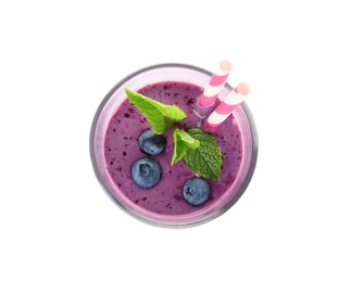 Photo of Glass of delicious blueberry smoothie with mint and straw on white background, top view