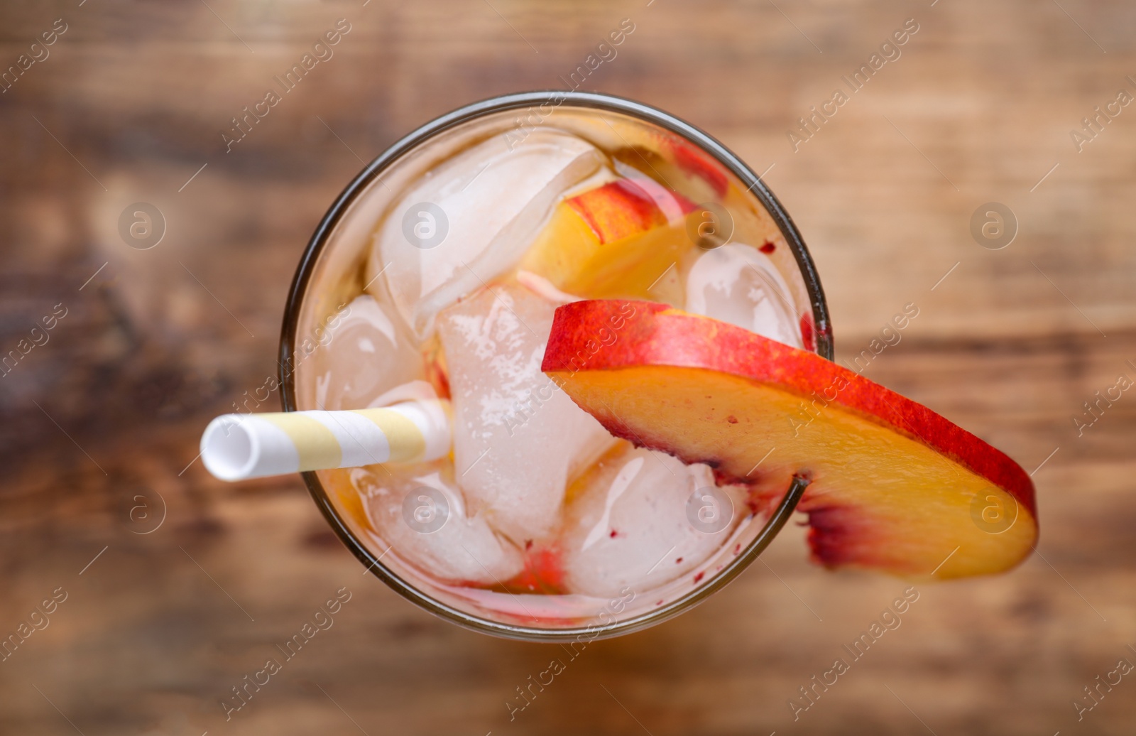 Photo of Delicious peach lemonade made with soda water on table, top view