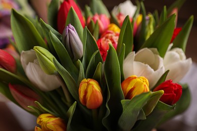 Photo of Beautiful bouquet of colorful tulip flowers, closeup