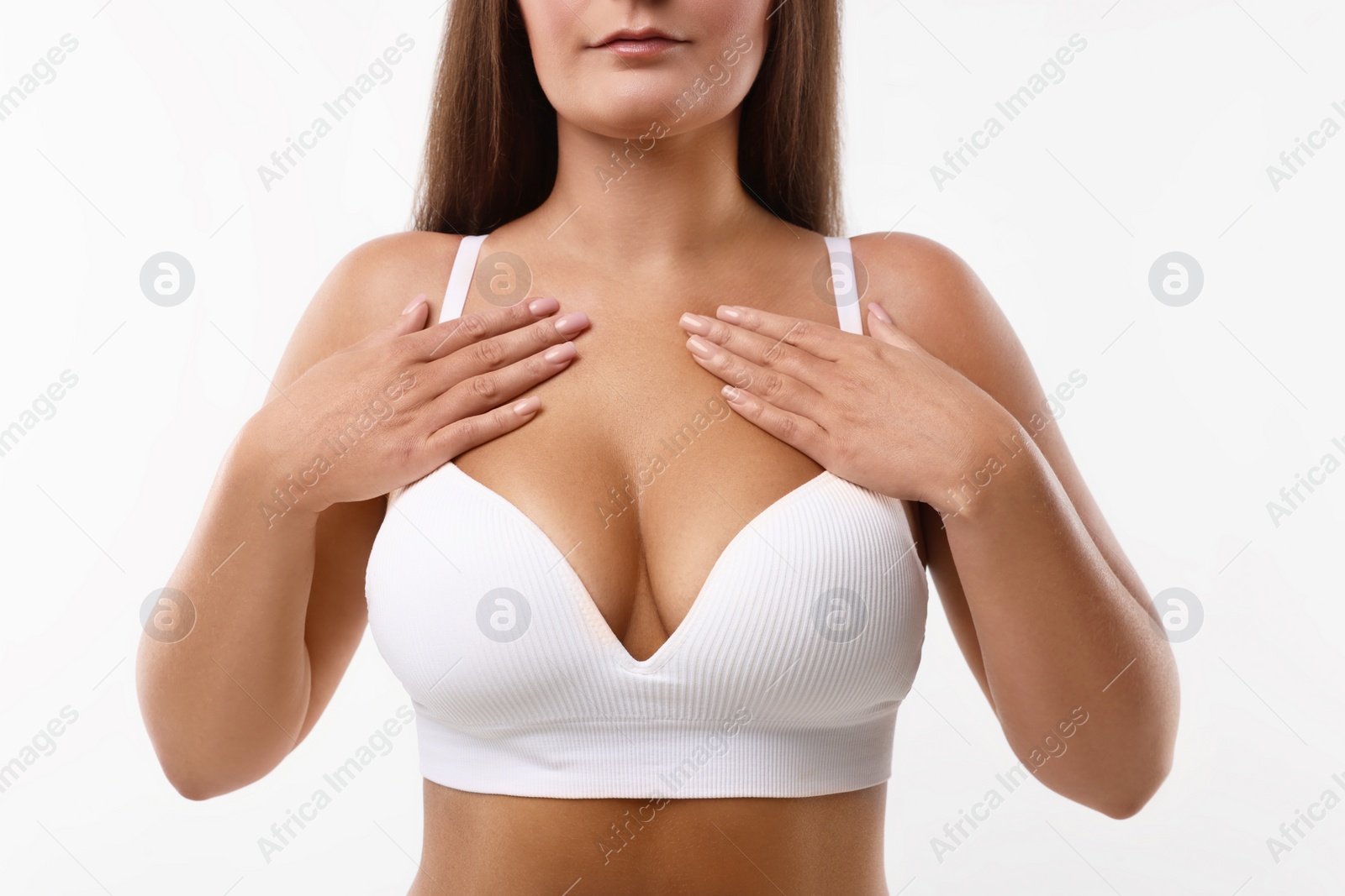 Photo of Woman with beautiful breast on white background, closeup