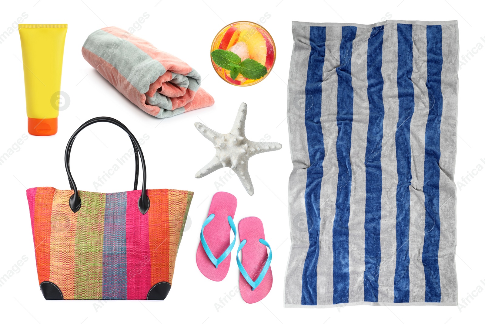 Image of Set with towel and other beach accessories on white background