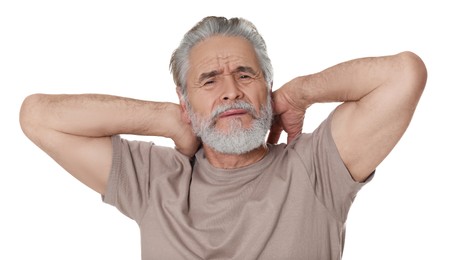 Senior man suffering from pain in neck on white background. Arthritis symptoms