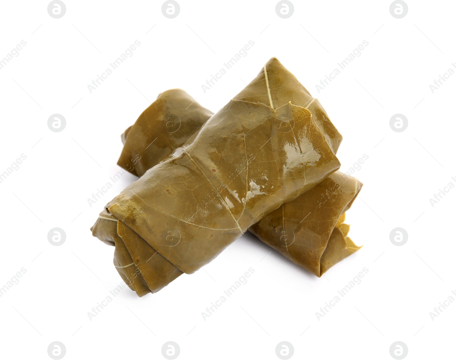 Photo of Delicious stuffed grape leaves on white background