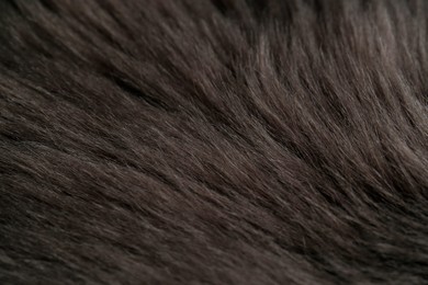 Beautiful dark faux fur as background, closeup view