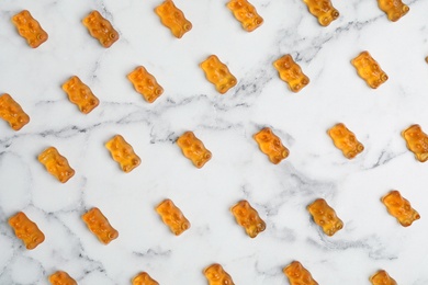 Photo of Delicious little jelly bears on table, top view