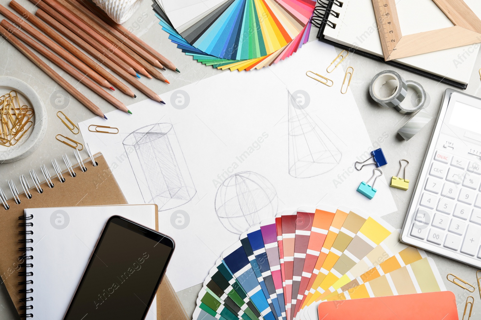 Photo of Flat lay composition with drawing of geometry shapes on table. Designer's workplace