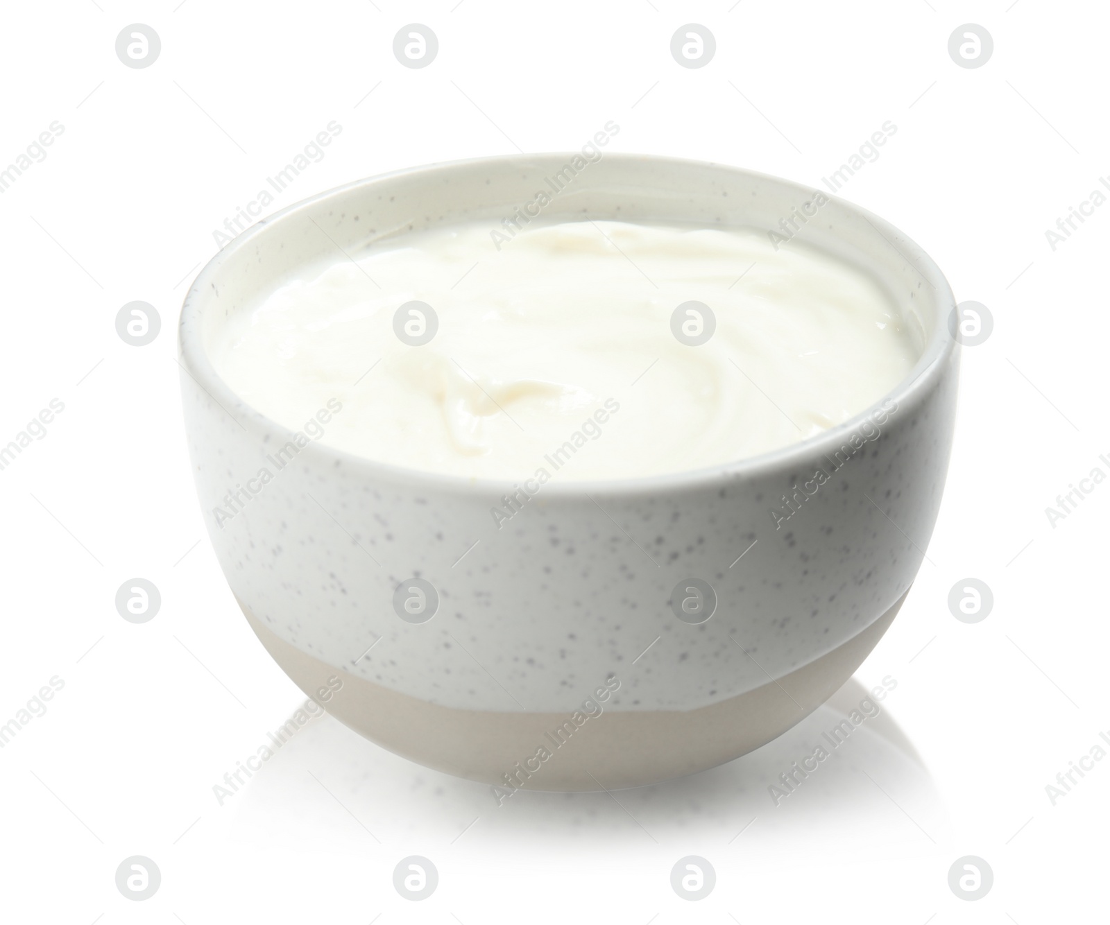 Photo of Bowl with creamy yogurt on white background