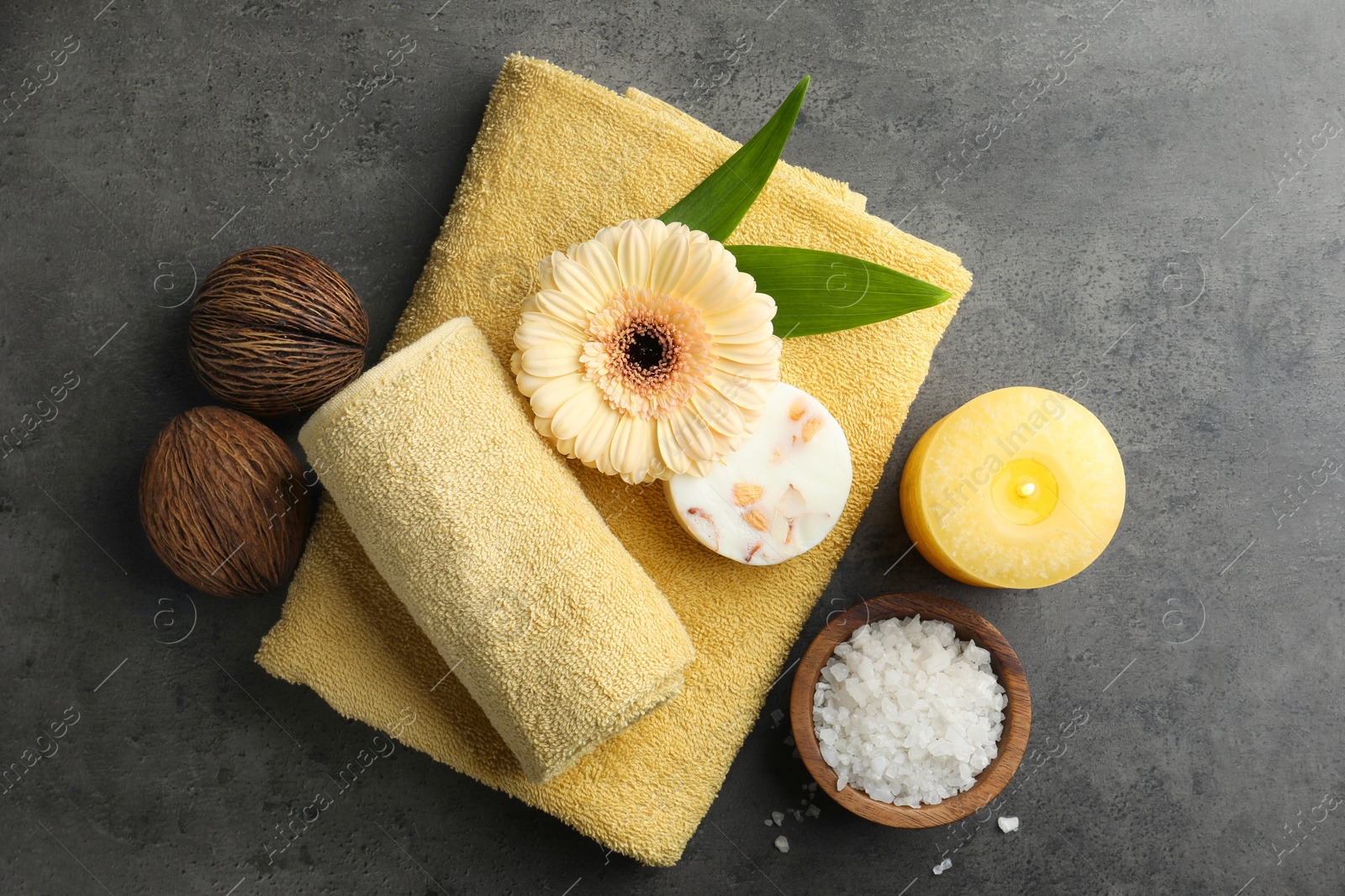 Photo of Flat lay composition with different spa products and walnuts on grey table