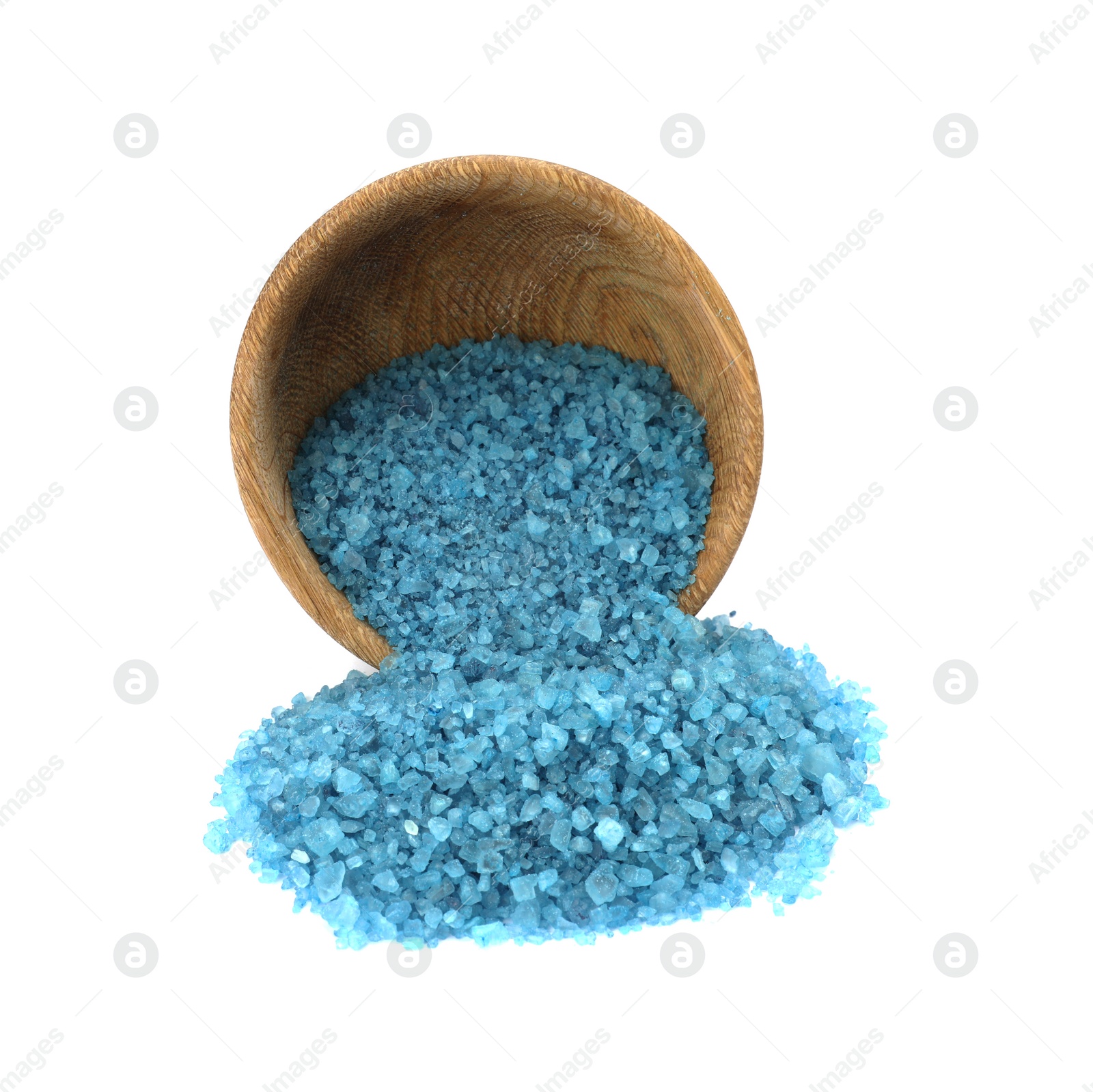 Photo of Overturned bowl with blue sea salt isolated on white