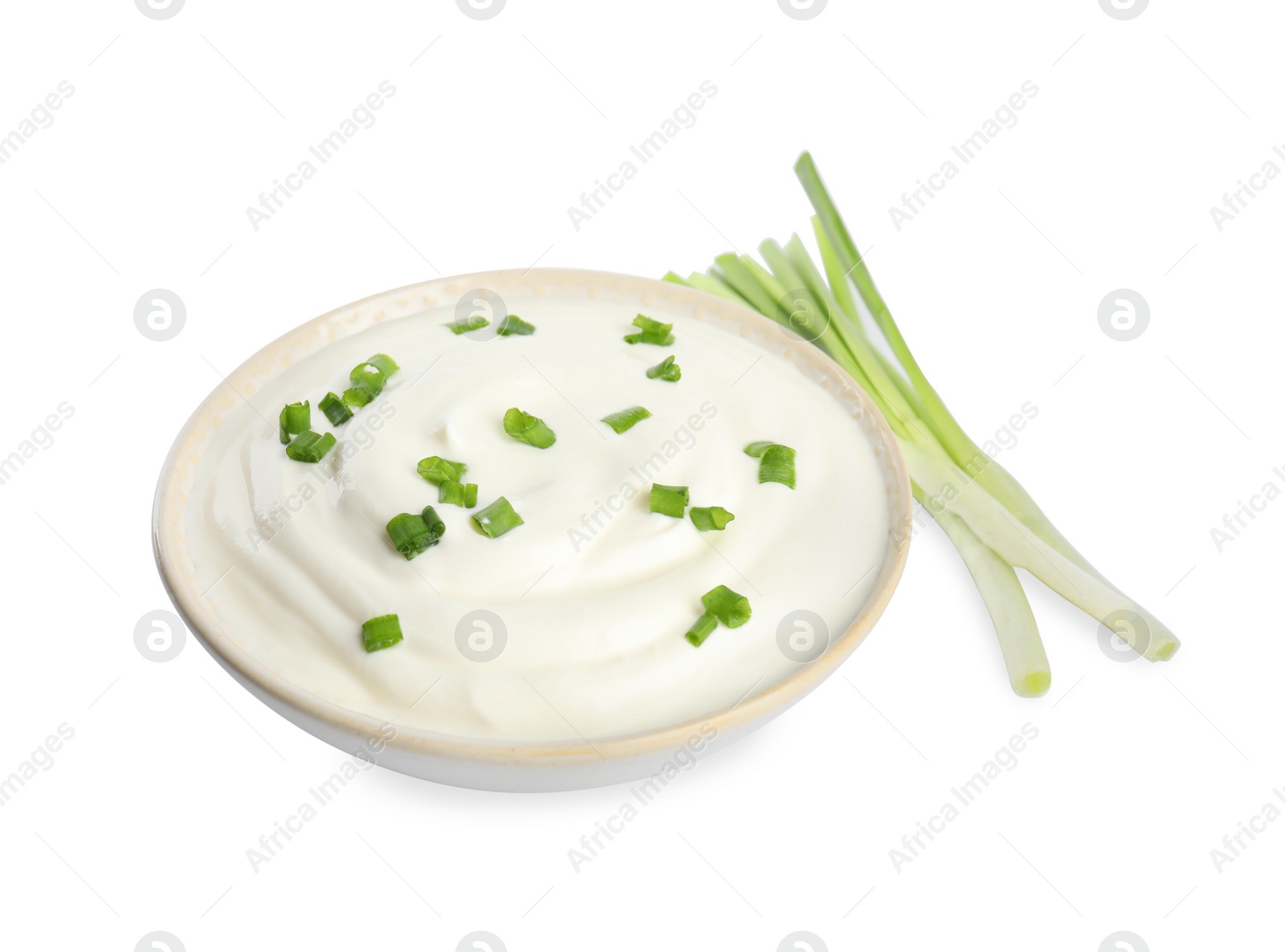 Photo of Fresh sour cream with onion on white background