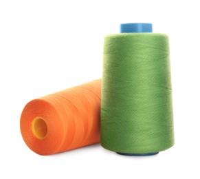 Photo of Different colorful sewing threads on white background