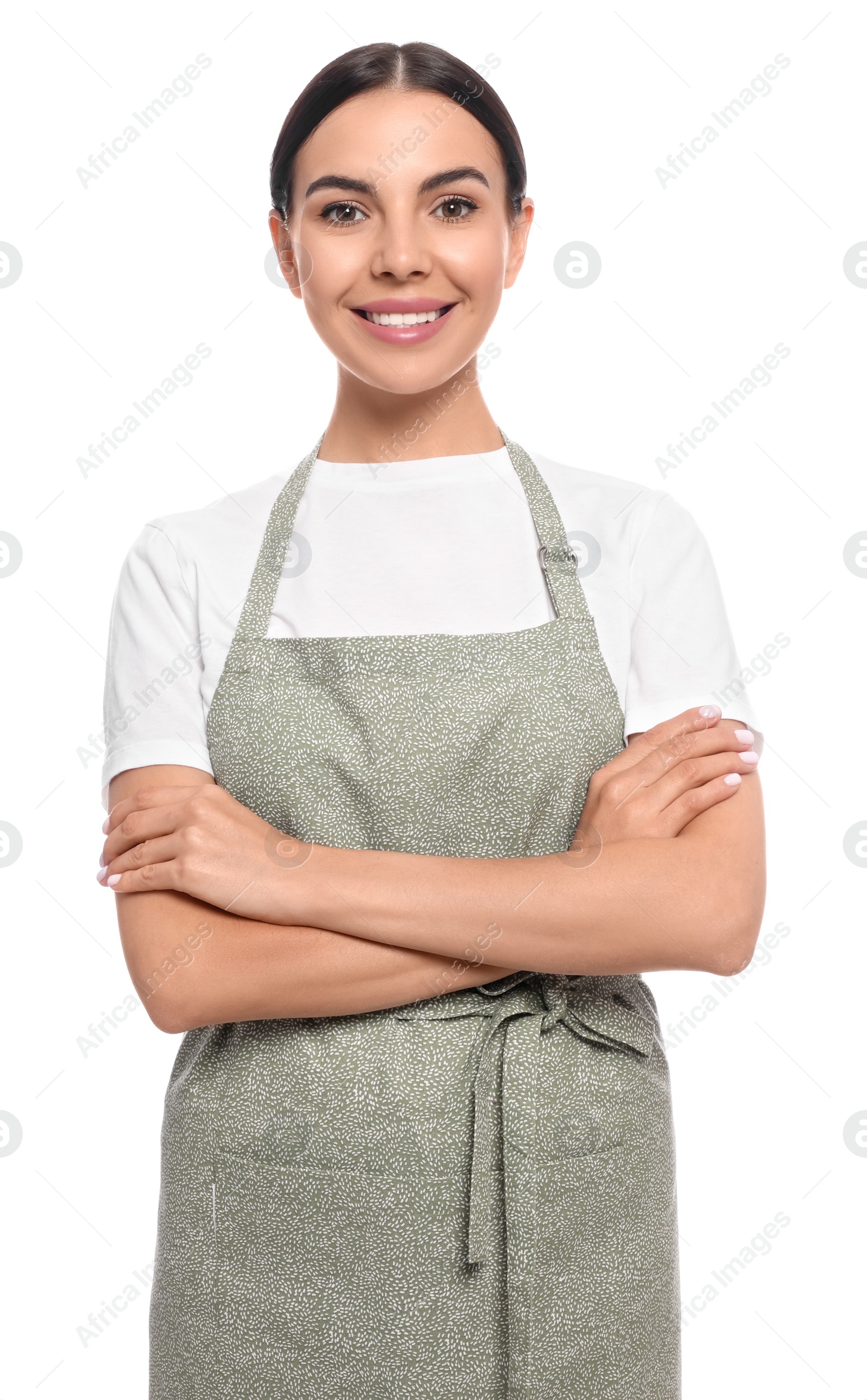 Photo of Young woman in light green apron on white background