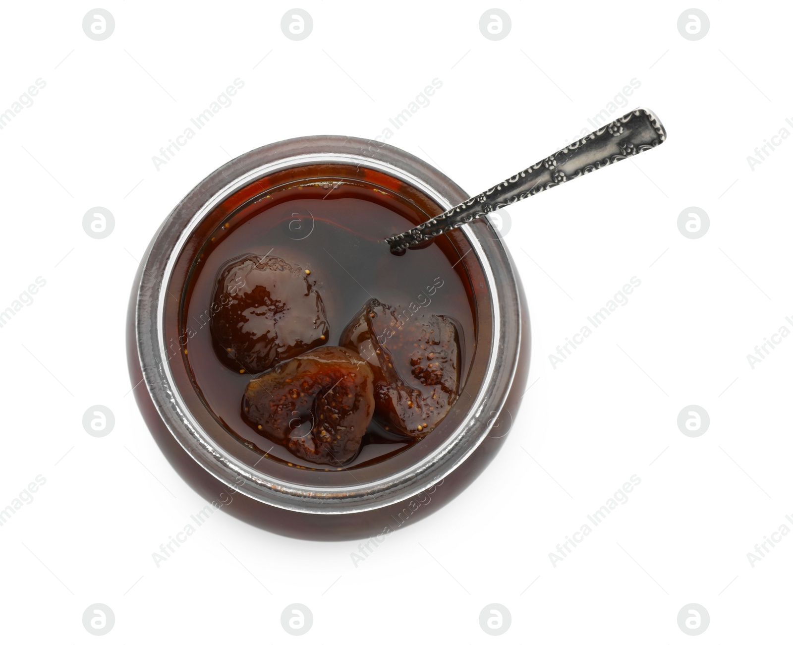 Photo of Jar of tasty sweet fig jam and spoon isolated on white, top view