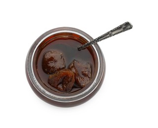 Jar of tasty sweet fig jam and spoon isolated on white, top view