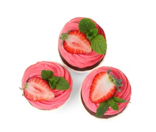 Photo of Sweet cupcakes with fresh strawberries on white background, top view