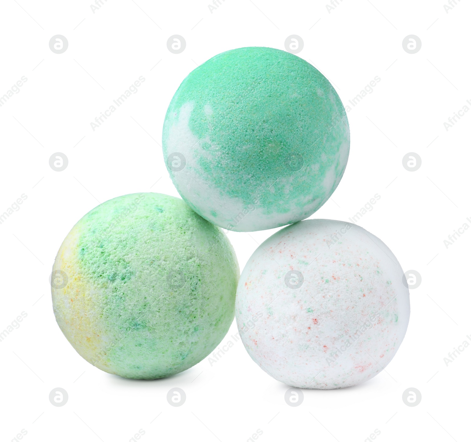 Photo of Three colorful bath bombs on white background