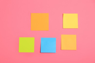 Photo of Many colorful stickers on pink background, flat lay