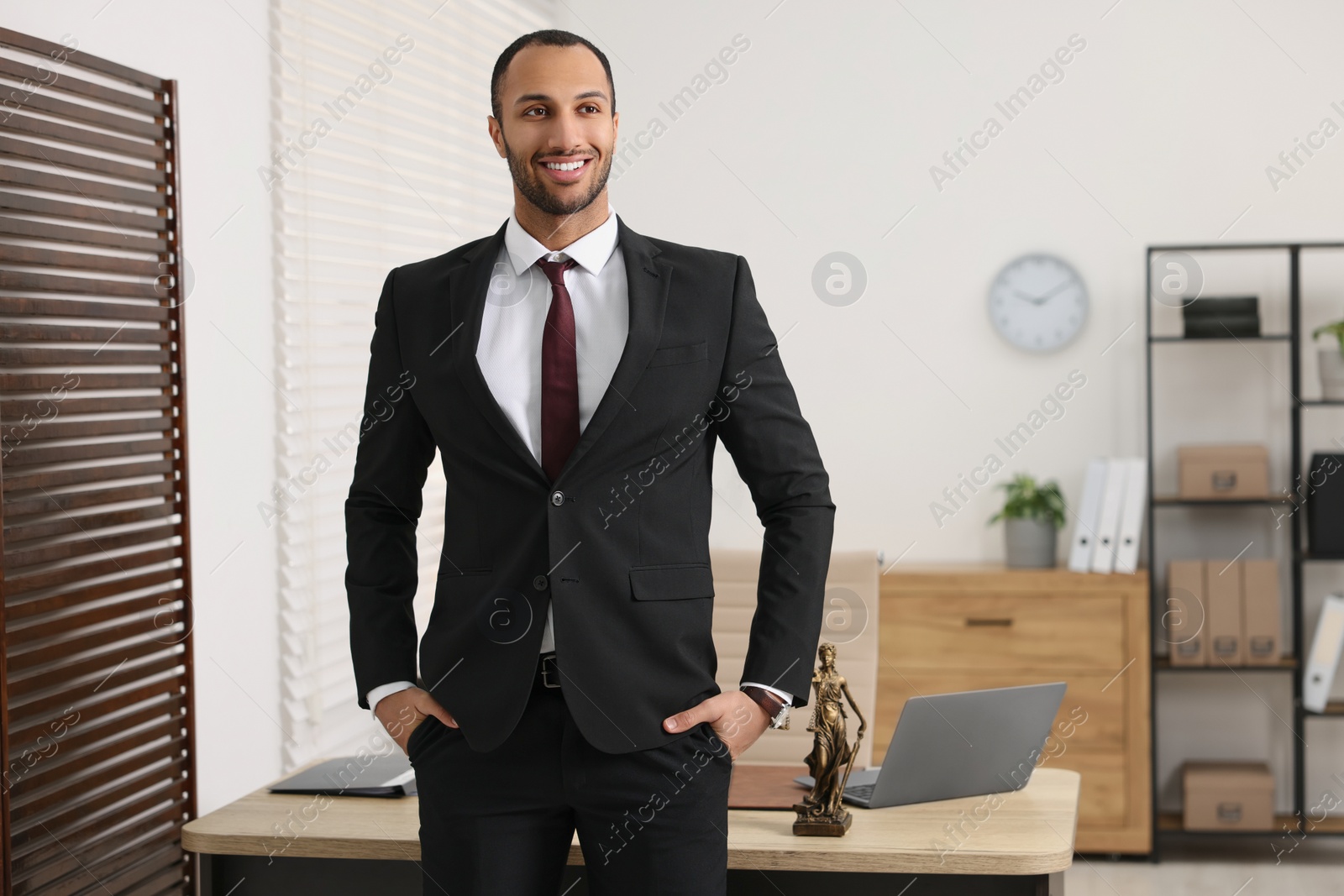 Photo of Portrait of smiling lawyer in office, space for text