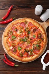 Photo of Delicious pizza Diablo served on wooden table, flat lay