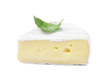Photo of Piece of tasty brie cheese with basil isolated on white