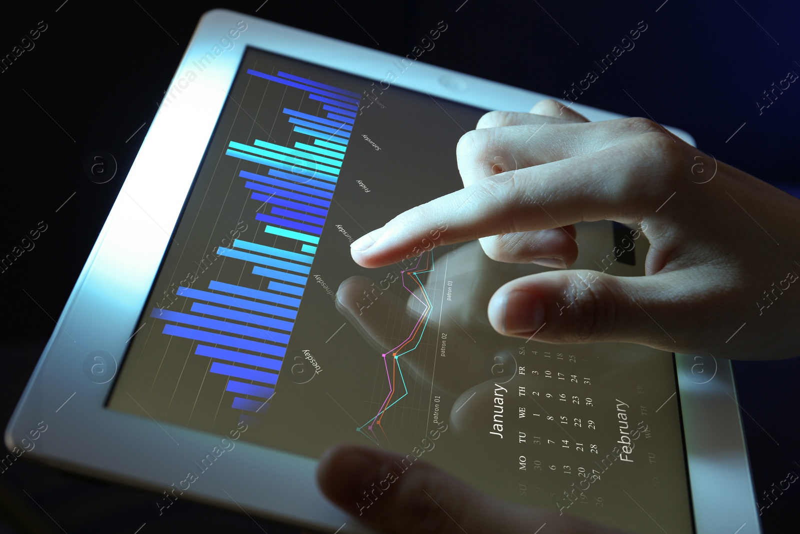 Image of Broker using tablet on dark background, closeup. Forex trading