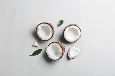 Composition with coconuts on white background, top view