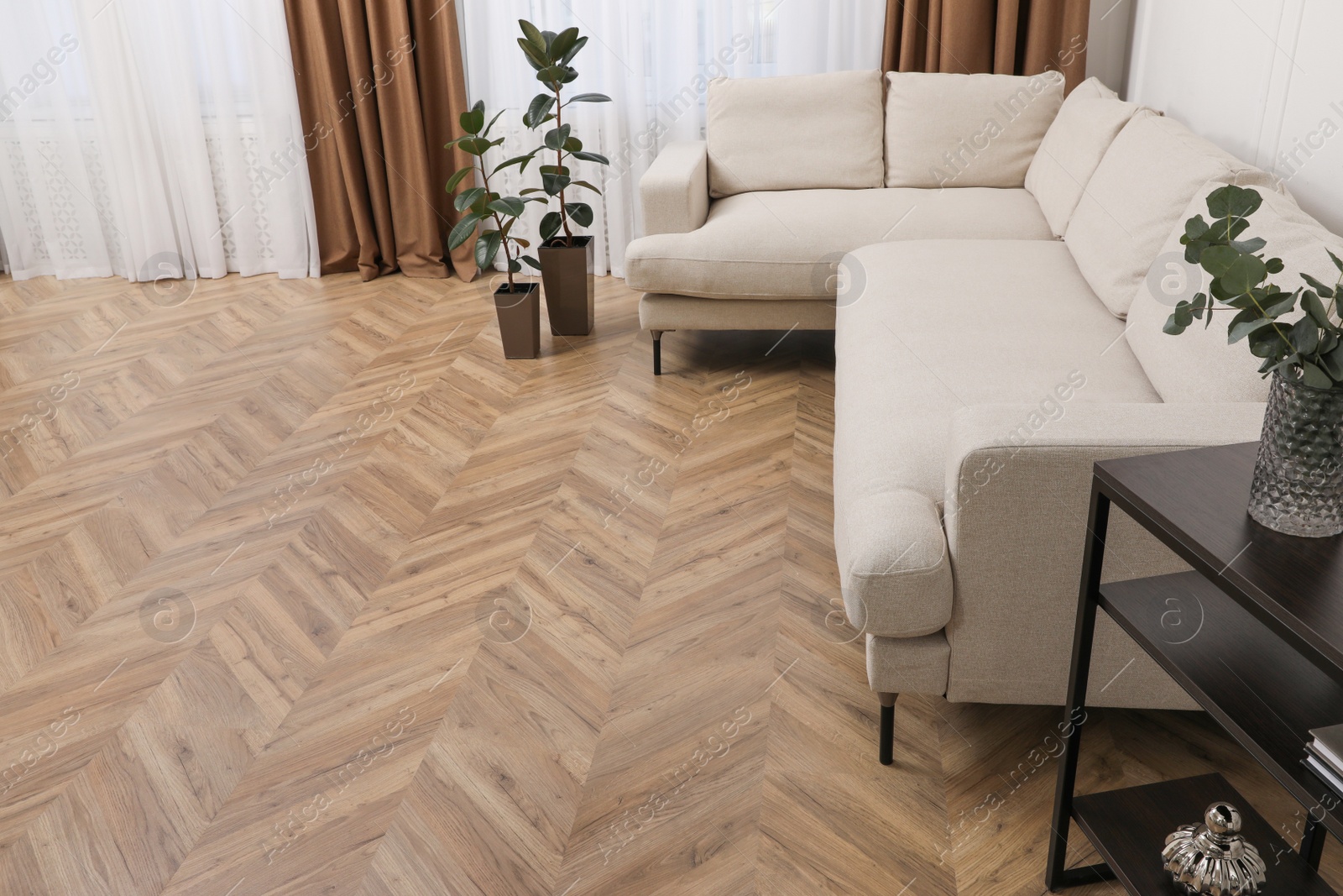 Photo of Modern living room with parquet flooring and stylish furniture