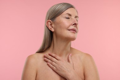 Photo of Beautiful woman with healthy skin on pink background