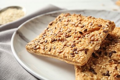 Plate with homemade grain cereal cookies on table, closeup. Healthy snack