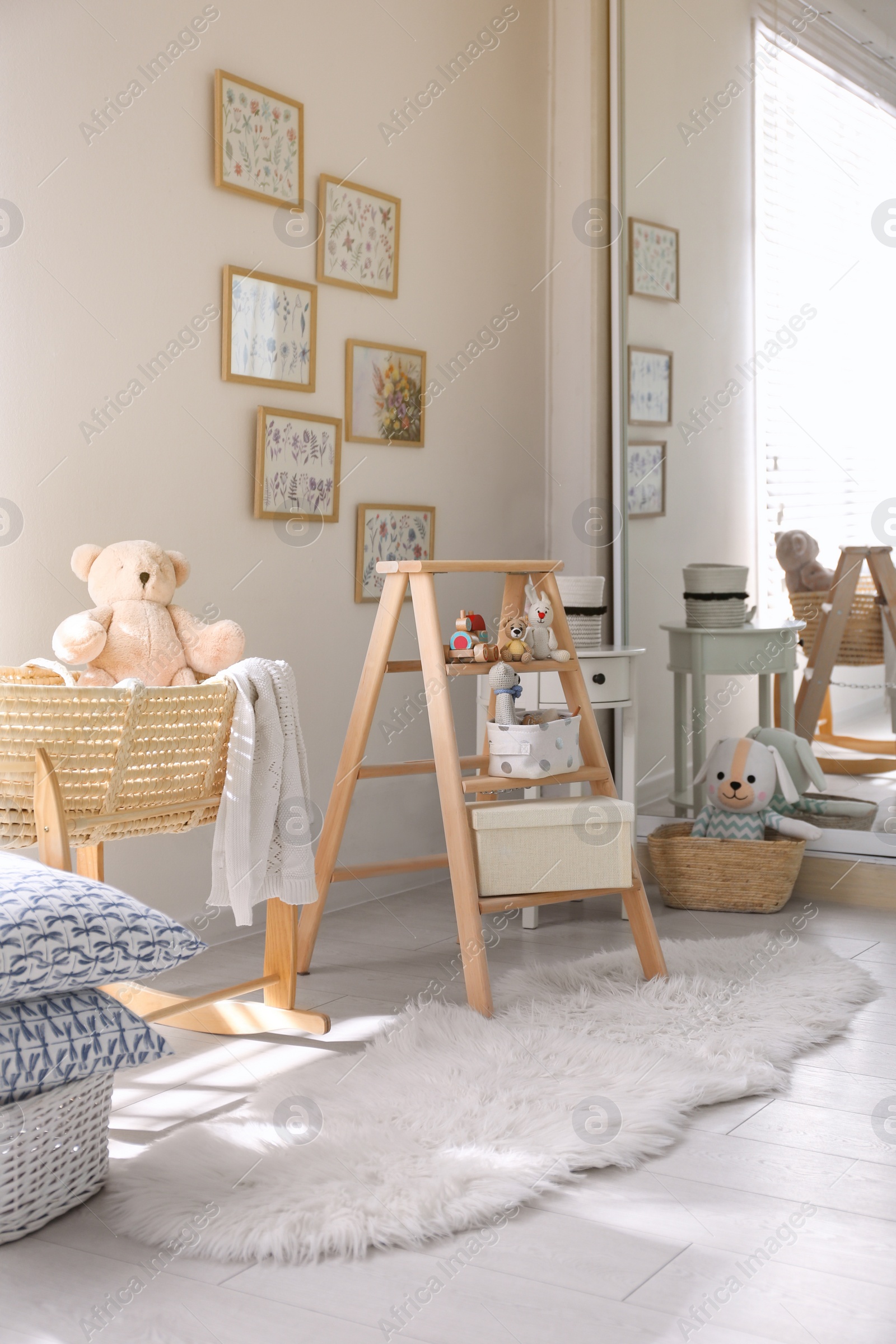 Photo of Decorative ladder with toys and different stuff in stylish baby room. Idea for interior design