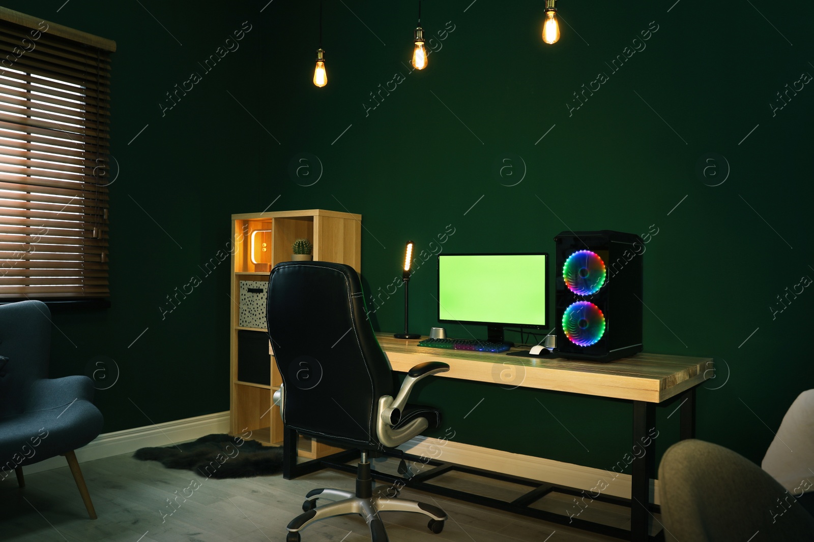 Photo of Modern computer and RGB keyboard on wooden table indoors. Mockup green screen