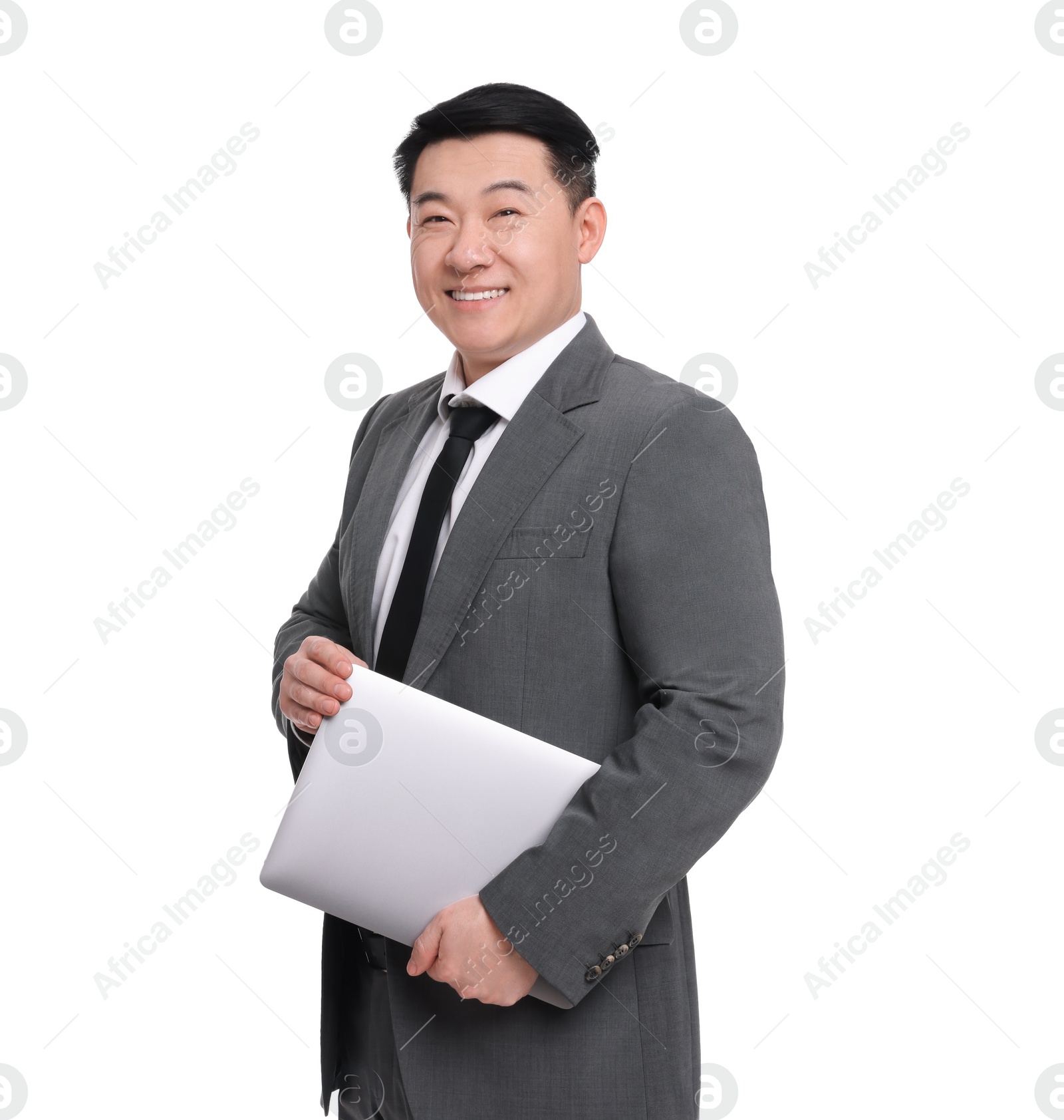 Photo of Businessman in suit with laptop posing on white background