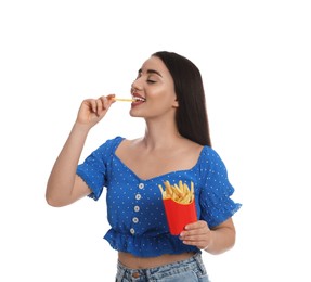 Photo of Beautiful young woman eating French fries on white background