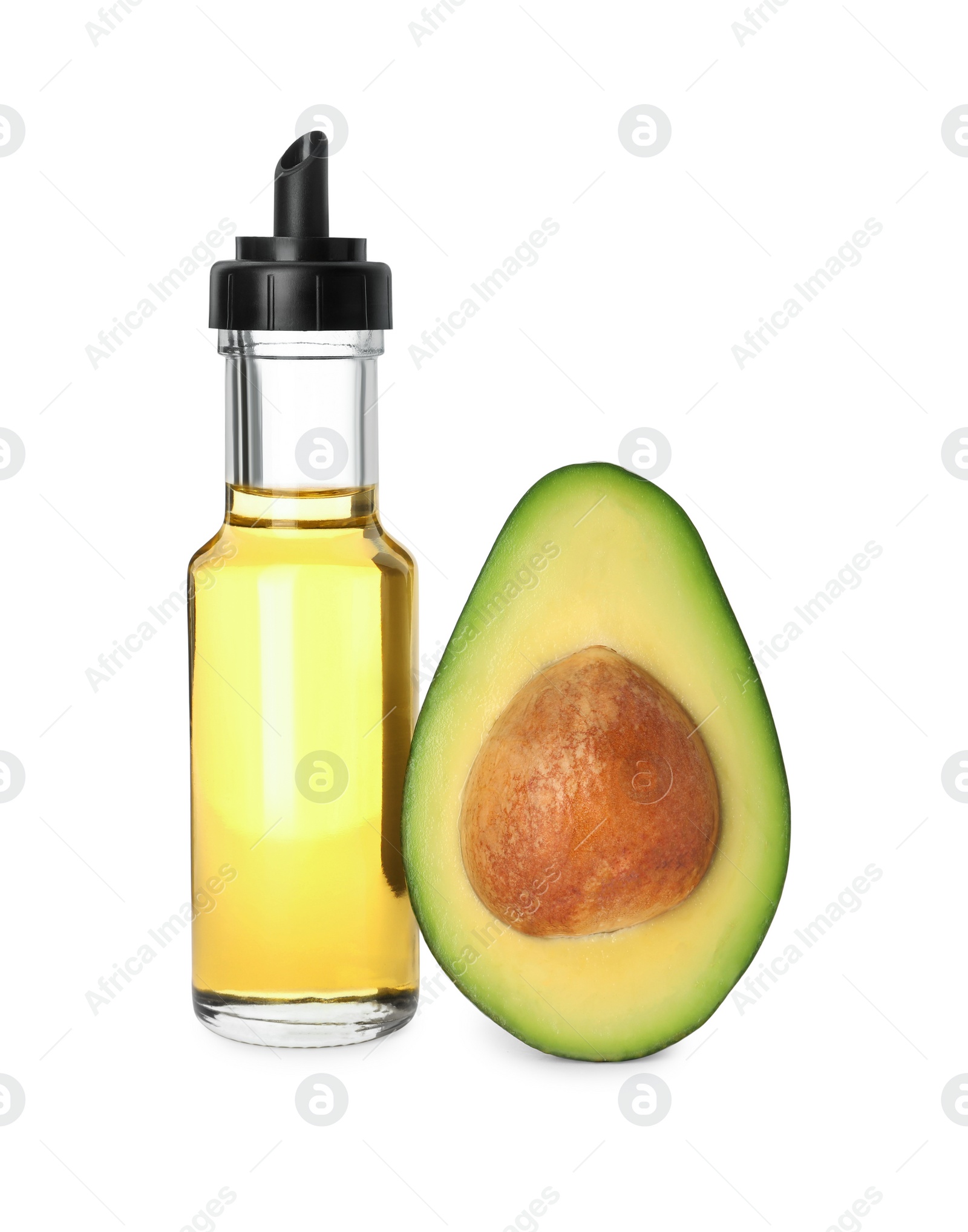 Photo of Cooking oil and half of fresh avocado isolated on white