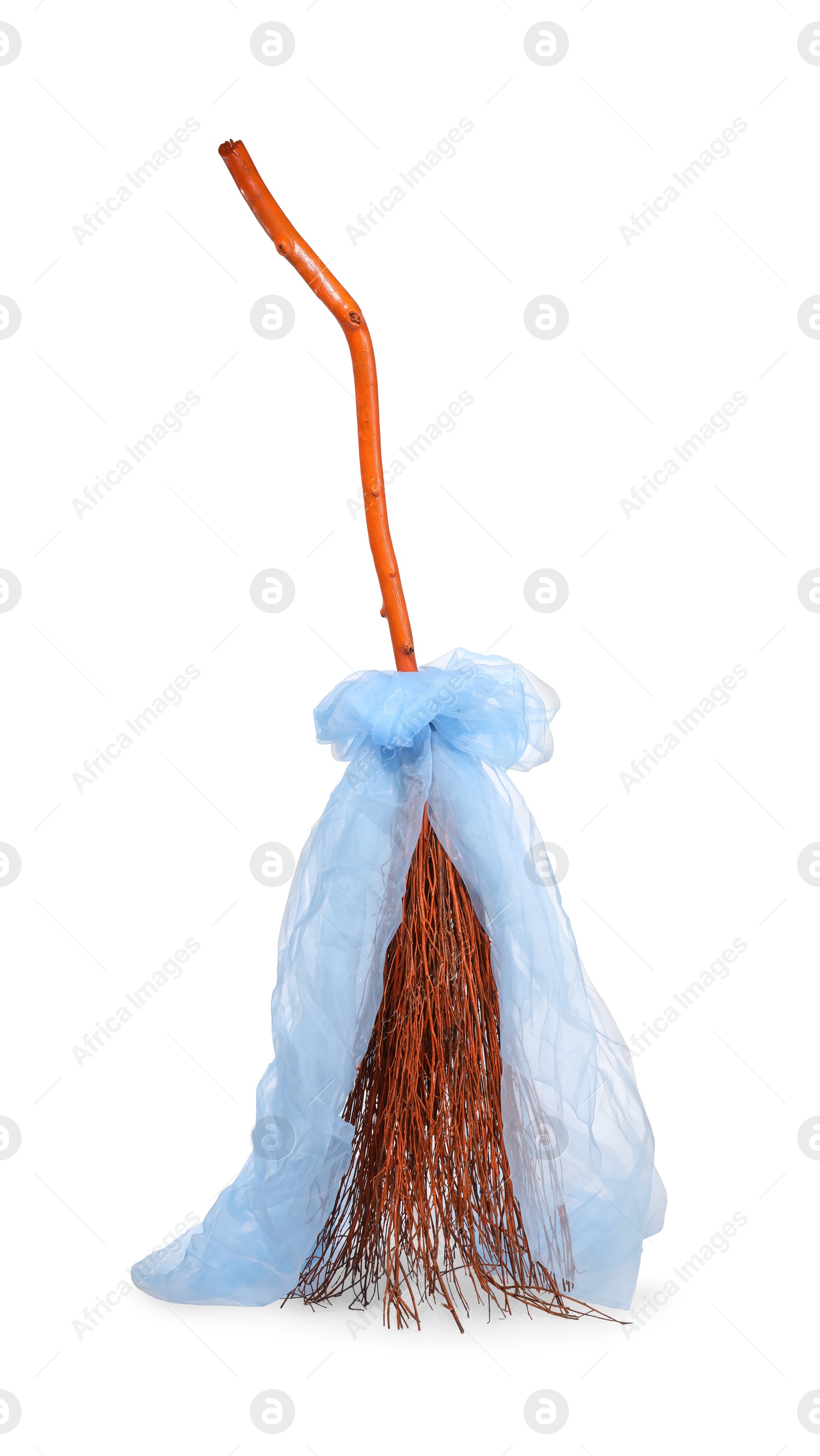 Photo of One beautiful witch's broom with tulle isolated on white